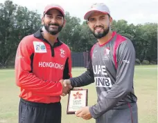  ?? ACC ?? Adnan Mufti, right, and his UAE teammates will need to be on the top of their game for today’s final. Hong Kong captain Anshuman Rath, above left with UAE skipper Rohan Mustafa, scored 102 in their 182-run group stage victory over the Emirates