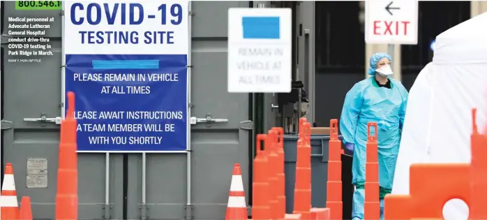  ?? NAM Y. HUH/AP FILE ?? Medical personnel at Advocate Lutheran General Hospital conduct drive-thru COVID-19 testing in Park Ridge in March.