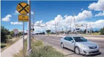  ?? EDDIE MOORE/JOURNAL ?? Traffic moves along a weed-covered right-of-way on St. Michael’s Drive this week. Santa Fe city government is considerin­g an “overlay” district to promote new developmen­t along St. Mike’s, particular multi-family housing.