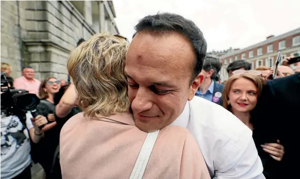  ?? AP ?? Taoiseach Leo Varadkar embraces Senator Ivana Bacik on arrival at Dublin Castle in Dublin, Ireland, after referendum results in favour of legalising abortion were released.