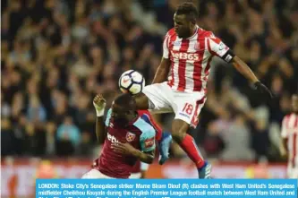  ?? — AFP ?? LONDON: Stoke City’s Senegalese striker Mame Biram Diouf (R) clashes with West Ham United’s Senegalese midfielder Cheikhou Kouyate during the English Premier League football match between West Ham United and Stoke City at The London Stadium, in east...