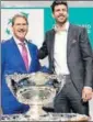  ?? AFP ?? ITF president David Haggerty (L) and Gerard Pique pose with the trophy after the draw.