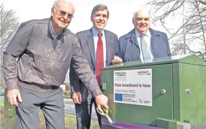  ??  ?? ●● Arthur Dicken cuts the ribbon with MP David Rutley (centre) and Coun Paul Findlow