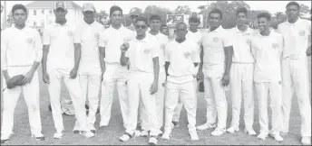  ?? (Royston Alkins Photo) ?? Niron Bissu is flanked by his teammates after bowling Demerara to another victory