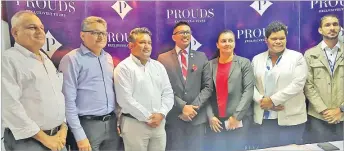  ?? Picture: ELIKI NUKUTABU ?? Stakeholde­rs pose for a photo during the signing of the Voluntary Compliance Framework between Prouds and the FCCC in Suva.