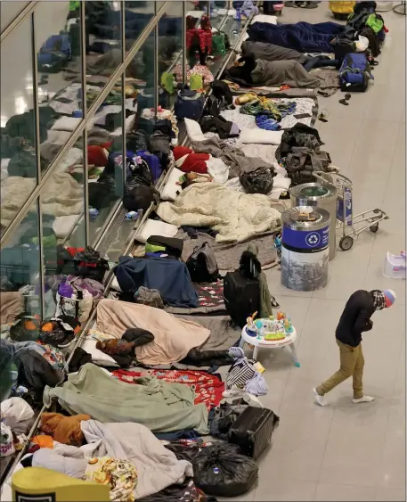  ?? MATT STONE — BOSTON HERALD ?? The Healey administra­tion is looking into opening an overflow shelter at the Melnea Cass Recreation Center, in part to house families who have been sleeping at Logan Airport.