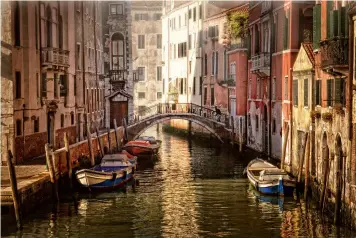  ?? ?? Above: No cars and sunlit water creates a magical atmosphere. Below left: Elegance at Aman Venice. Below right: Caffè Florian makes hot chocolate worthy of the name