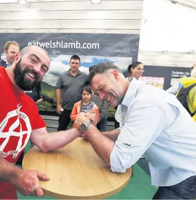  ?? Pictures: Robert Parry-Jones ?? arm-wrestling with Welsh actor Julian Lewis Jones in the HCC stand