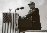  ?? Evan Vucci / Associated Press ?? Democratic presidenti­al candidate Joe Biden talks at a drive-in rally at Broward College in Coconut Creek, Fla., while President Donald Trump speaks at a campaign rally outside Raymond James Stadium in Tampa.