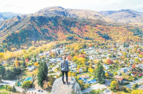  ?? Picture / Debbie Pettinger ?? Debbie Pettinger's photo of her daughter Jade surveying the riot of changing colours in Arrowtown won an Otago Daily Times "Awesome autumn" photograph­ic competitio­n.