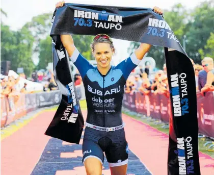  ?? Photo / Supplied ?? Hannah Wells winning Ironman 70.3 Taupo¯ .