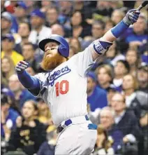  ??  ?? THE DODGERS looked poised to lose the first two games of the series until Justin Turner’s eighth-inning home run lifted them to a Game 2 win and sent the series back to L.A. tied.