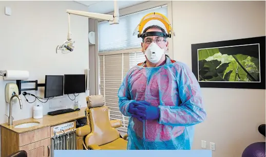  ?? JULIE JOCSAK TORSTAR ?? Dr. Ernie Philpott at Falls Family Dental, where he is still conducting emergency procedures.