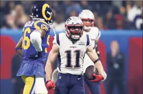  ?? Al Bello / Getty Images ?? Patriots WR Julian Edelman celebrates a first down reception in the second half of Super LIII against the Rams in Atlanta. Edelman, the MVP of Super Bowl LIII, announced his retirement on Monday after 11 seasons.