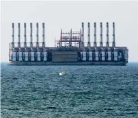  ?? — AP file ?? The floating power station waits off the coast at Jiyeh, south of Beirut, Lebanon.