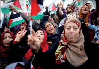  ?? MOHAMMED SALEM / REUTERS ?? Palestinia­n women shout slogans during a protest against the US intention to move its embassy to Jerusalem and to recognize the city of Jerusalem as the capital of Israel, in Gaza City on Wednesday.