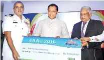  ??  ?? Dr. Athula Kahandaliy­anage, Director Corporate Affairs of Fonterra hands over the sponsorshi­p cheque to Sports Minister Dayasiri Jayasekera and Captain Jayantha Gamage, President Sri Lanka Aquatic Sports Union. - PIC BY PRADEEP PATHIRANA