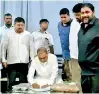  ??  ?? Agricultur­e Minister Mahinda Amaraweera signs the agreement in the presence of Grains n’ Greens Ltd Managing Director Roshan Perera (extreme right) and Agricultur­e Deputy Minister Angajan Ramamantha­n