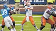  ?? THOMAS GRANING / AP ?? UF quarterbac­k Kyle Trask delivered a career-high six touchdown passes in leading the Gators to a 51-35 season-opening road win over Ole Miss on Saturday.