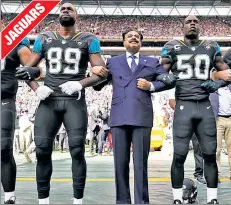  ??  ?? DUEL LOYALTIES: Jacksonvil­le owner Shahid Khan, who donated $1 million to Trump’s inaugurati­on, stands united with his team in London.