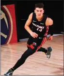  ?? KEVIN C. COX/GETTY IMAGES ?? The Heat’s Tyler Herro after a lay-up against the Boston Celtics in Game 4 of the Eastern Conference Finals on Wednesday in Lake Buena Vista, Fla.