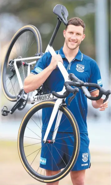 ?? Picture: GLENN FERGUSON ?? BACK IN THE SADDLE: Avid cyclist and Geelong midfielder Sam Menegola is an ambassador for January’s Cadel Evans Great Ocean Road event.
