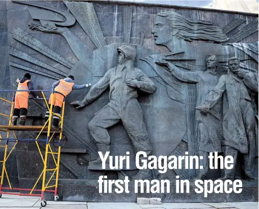  ??  ?? Workers clean the bas-relief of cosmonaut Yuri Gagarin at the National Cosmonauti­cs Museum in Moscow. Sixty years ago, Gagarin became the first person in space, marking a new chapter in history. — Photos/AFP