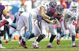  ?? BILL INGRAM / THE PALM BEACH POST ?? Miami defensive tackle Ndamukong Suh earns his first sack of the season on Sunday, bringing down Houston quarterbac­k Brian Hoyer.