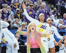  ?? MATTHEW HINTON/AP ?? LSU head coach Kim Mulkey, center front, reacts to a call during the second half against Ohio State in the second round of the women’s NCAA tournament on March 21 in Baton Rouge, La.