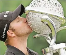  ??  ?? DEAN Burmester kissing the Tshwane Open trophy, his first European Tour title. | Sunshineto­ur.com