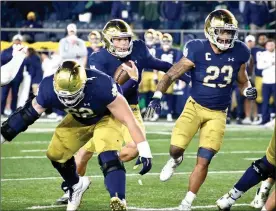  ?? PHOTO/BEV HARAMIA ?? Tyler Buchner runs for a touchdown in the Notre Dame vs. USC game Saturday night.