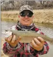  ?? COURTESY PHOTO ?? Jonathon Casados of Mora caught a 16-inch rainbow trout using a gold Mepps spinner in the Albuquerqu­e Area Drains.