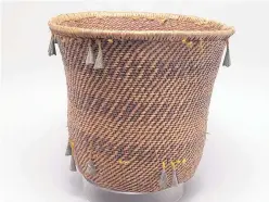  ??  ?? Mescalero Apache burden basket, late 19th century to early 20th century, twined willow, tin tinklers.
