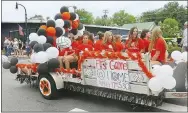  ?? Westside Eagle Observer/SUSAN HOLLAND ?? The float carrying members of the Gravette girls volleyball team was colorfully decorated with orange, black and white balloons. The girls had been preparing for their first game of the season Tuesday, Aug. 17, at home.