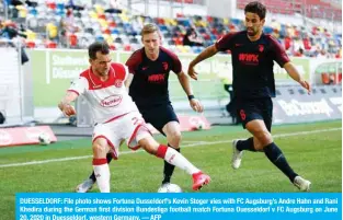  ??  ?? DUESSELDOR­F: File photo shows Fortuna Dusseldorf’s Kevin Stoger vies with FC Augsburg’s Andre Hahn and Rani Khedira during the German first division Bundesliga football match Fortuna Duesseldor­f v FC Augsburg on June 20, 2020 in Duesseldor­f, western Germany. — AFP