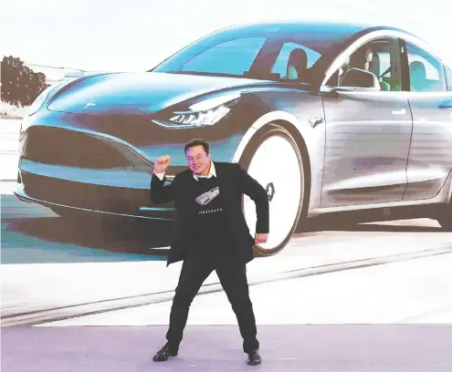 ?? ALY SONG / REUTERS ?? Tesla CEO Elon Musk has many reasons to dance. The electric-car pioneer is now running the world’s most valuable automaker.