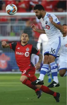  ?? RENÉ JOHNSTON/TORONTO STAR ?? Montreal’s Victor Cabrera gets some air time under pressure from Toronto FC’s Sebastian Giovinco in Tuesday night’s showdown.