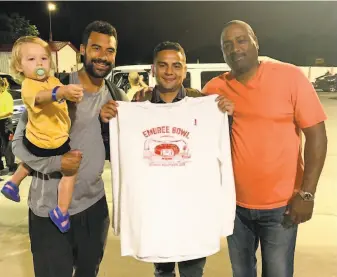  ?? Courtesy Embree family 2019 ?? Taylor Embree, a 49ers offensive assistant coach, holds son Grayson in Kansas City with brother Connor, a Chiefs defensive assistant coach, and dad Jon, the 49ers tight ends coach.