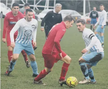  ??  ?? Ben Luntley gets on the ball for Newlands, tracked by Glenn O’Neil (left) and Curtis Rose