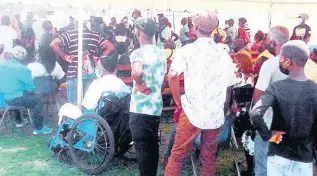  ?? PHOTO BY RUDDY MATHISON ?? Dozens of outpatient­s wait for medical attention at Spanish Town Hospital. None of the 157 junior doctors turned up for work Thursday.