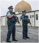  ??  ?? SAFEGUARD Armed police on watch