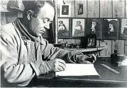  ?? ?? Captain Scott writes in his diary in a hut at Cape Evans in 1911