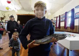  ?? ?? A reel good day . . . Holding his catch of the day, Sean Clark (11) shows off a goodsized brown trout.