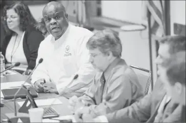  ?? Pam Panchak/Post-Gazette photos ?? Pittsburgh Public Schools board member Mark Brentley Sr. begins a meeting Friday of an ad hoc committee to brainstorm potential ways to save the August Wilson Center for African American Culture.