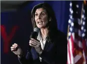  ?? AP ?? Presidenti­al candidate Nikki Haley speaks at a campaign rally Friday in New Hampshire. Donald Trump, also campaignin­g Friday, appeared to confuse Haley with Nancy Pelosi.