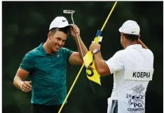  ?? AP/CHARLIE REIDEL ?? Brooks Koepka (left) celebrates with caddie Ricky Elliott after Koepka won the PGA Championsh­ip at Bellerive Country Club in St. Louis on Sunday.