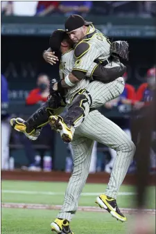  ?? RICHARD W. RODRIGUEZ — THE ASSOCIATED PRESS ?? Padres starting pitcher Joe Musgrove (44) and catcher Victor Caratini (17) celebrate Musgrove’s no-hitter against the Rangers Friday in Arlington, Texas.