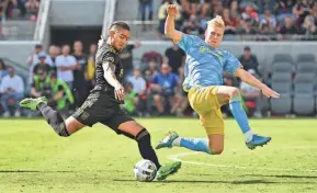  ?? JAYNE KAMIN-ONCEA/USA TODAY SPORTS ?? Los Angeles FC forward Cristian Arango, left, kicks the ball against Philadelph­ia Union defender Jakob Glesnes during the MLS championsh­ip game Nov. 5.