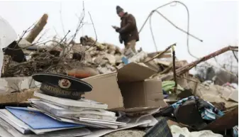  ?? ANATOLII STEPANOV/AGENCE FRANCE-PRESSE ?? RELATIVES look for personal belongings of a deceased family amid the rubble of a house which was destroyed by a missile attack in the town of Kramatorsk, Donetsk region, amid the Russian invasion of Ukraine, on 18 February 2024.