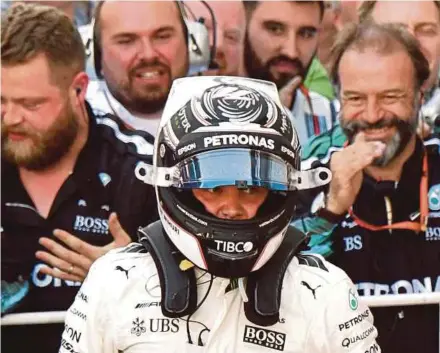  ?? AFP PIC ?? Mercedes driver Valtteri Bottas celebrates with the team’s crew after winning the Russian Grand Prix on Sunday.